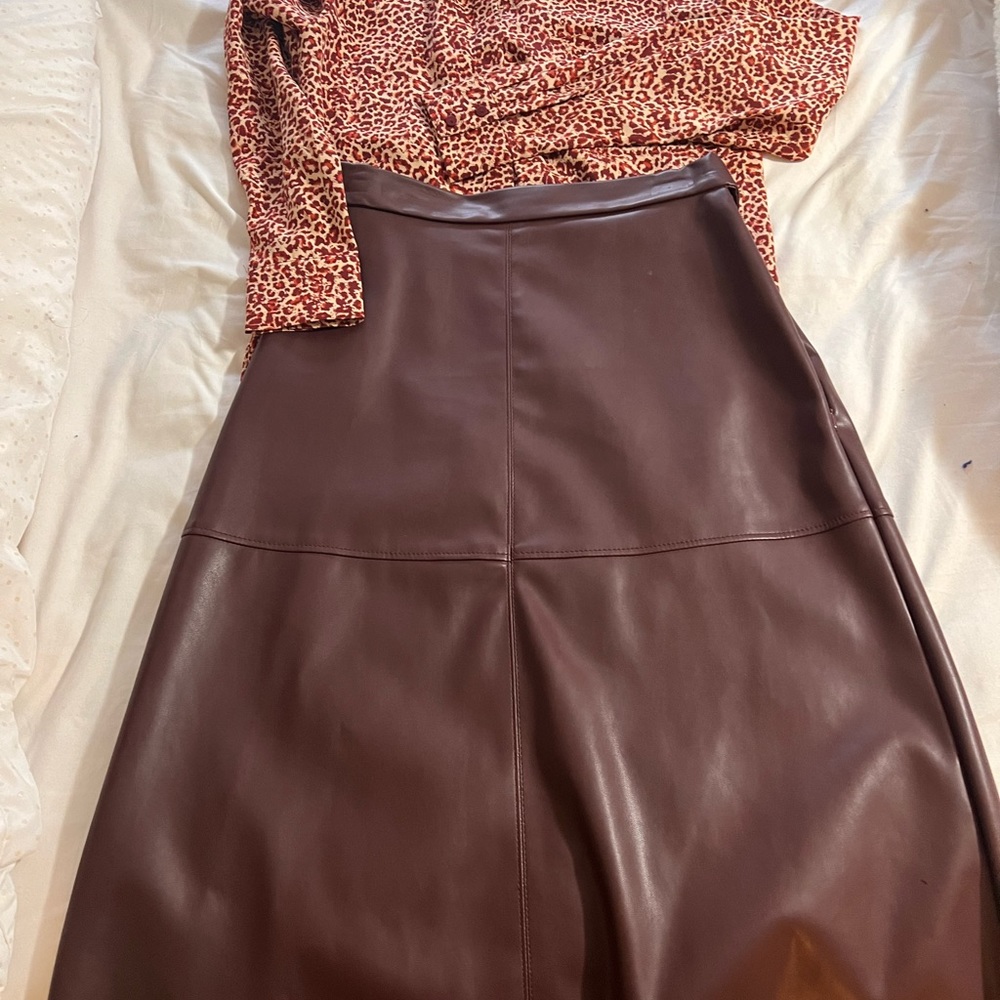 Very elegant leather skirt with matching blouse only worn once like new